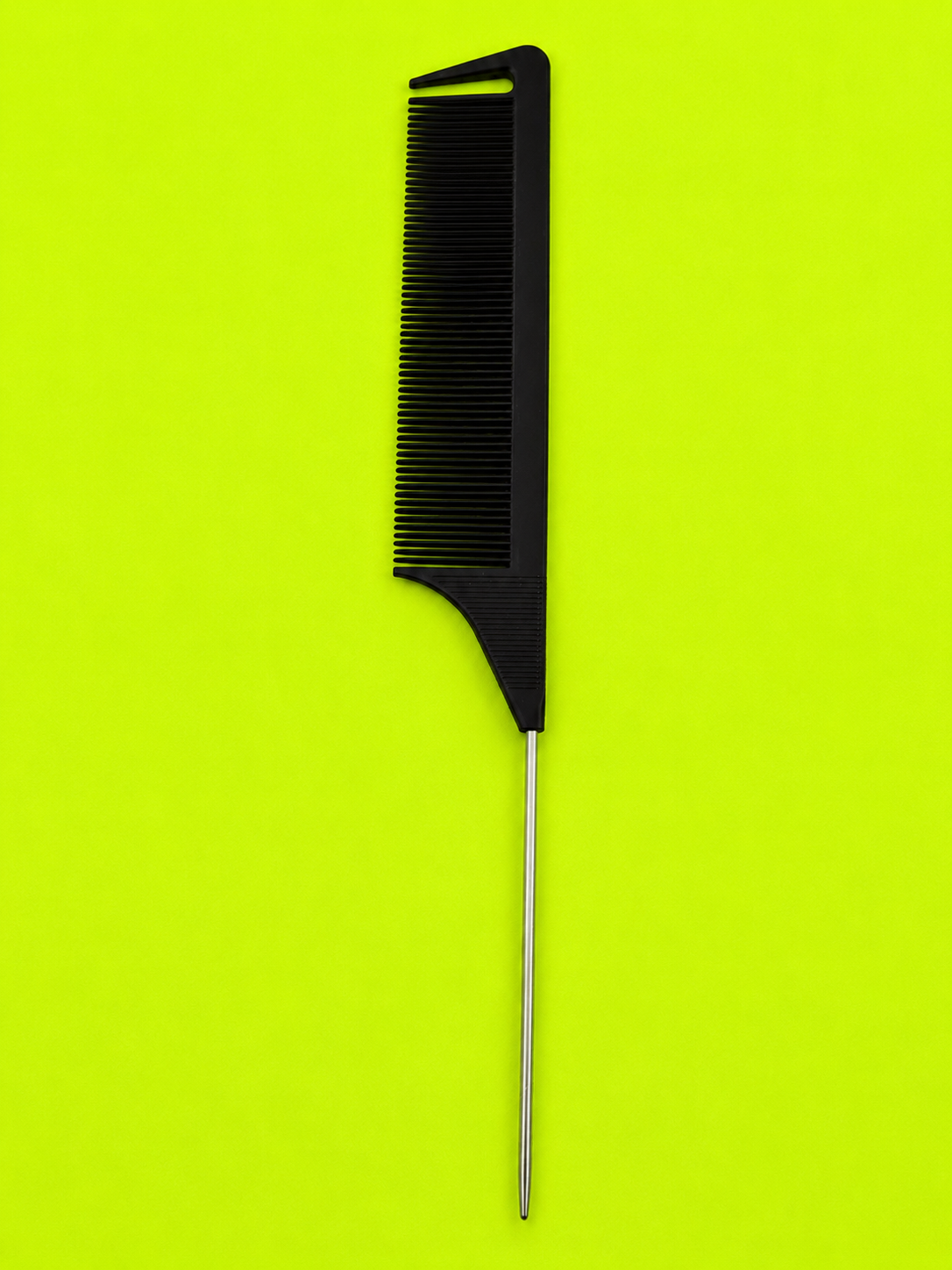 Precision Parting Comb on neon green background